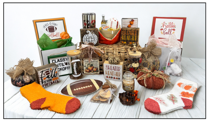 Collection of gift items including socks, pumpkins, and decorative boxes on a white surface.