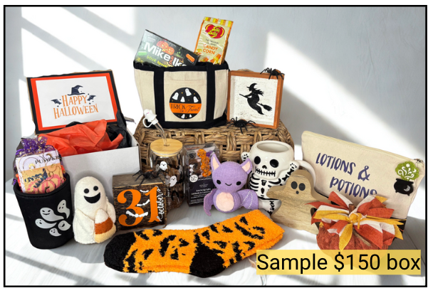 Halloween-themed gift basket with various items including a bag, plush toy, and socks on a white surface.
