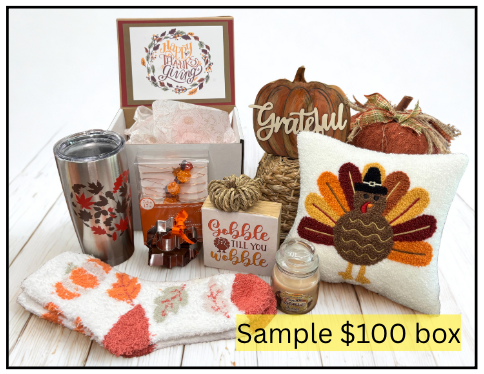 Collection of Thanksgiving-themed items including a tumbler, candles, and decorative pillows on a white surface.