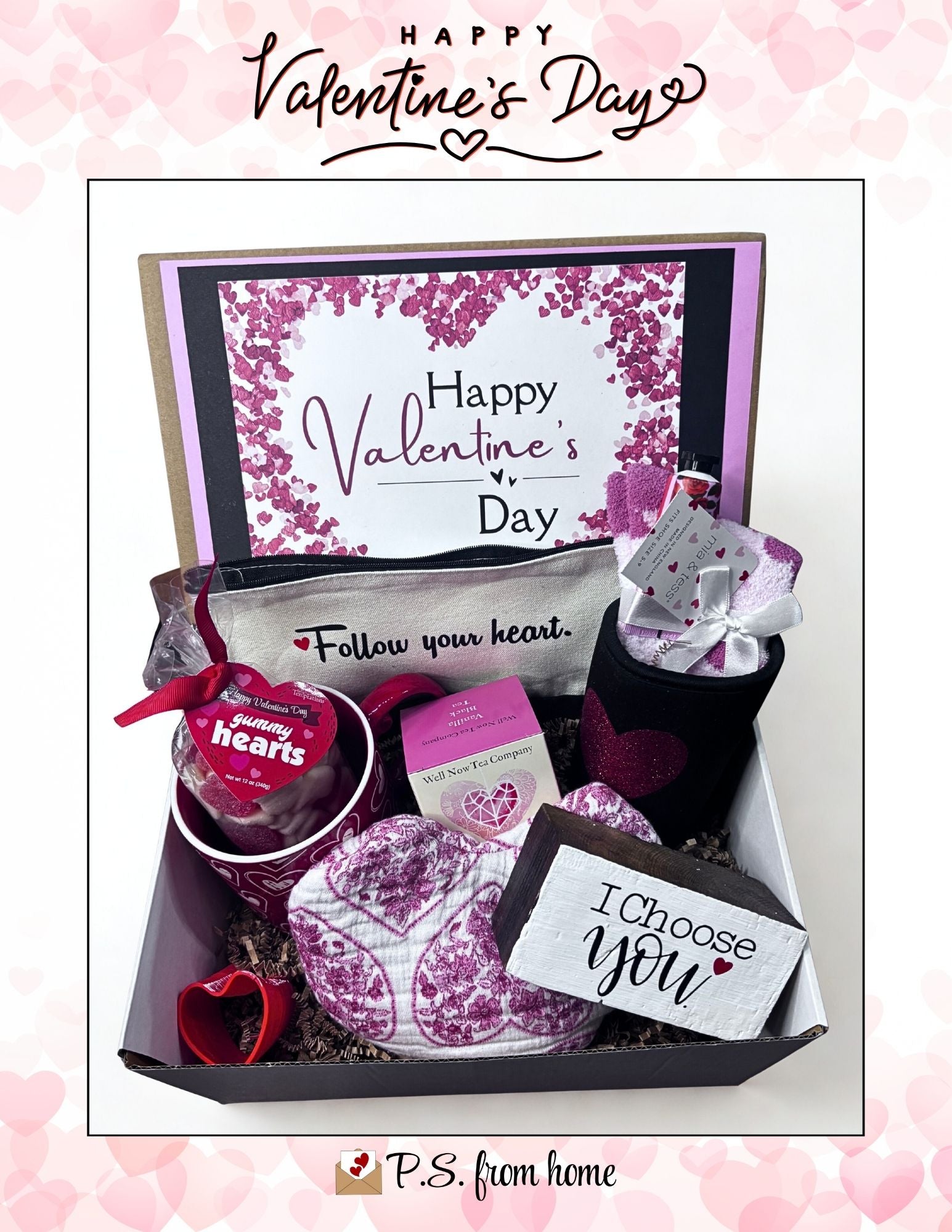 Valentine's Day gift box with a card, socks, and other items on a pink background.